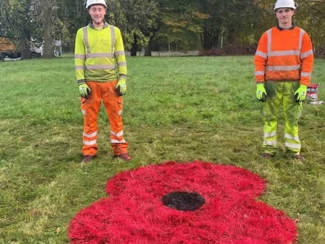 The large flowers are being sprayed by onto the centre island of ten roundabouts .