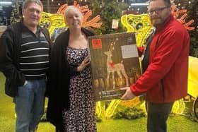 Kim Parrinder receives the reindeer from Woodthorpe Garden Centre