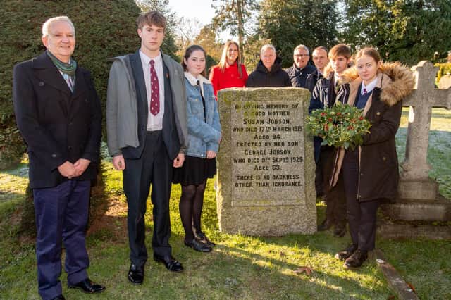 At the wreath laying, from left: Paul Brewster of the Horncastle Education Trust, Matthew Hunter from QEGS, Kirea Cullen of Banovallum, Sarah Steal from Chatterton Solicitors, Rainer Barnes of the Jobson Trust,  Banovallum headteacher Grant Edgar, QEGS headteacher Simon Furness, Charlie Ederson of Banovallum and Imogen Tyler from QEGS.