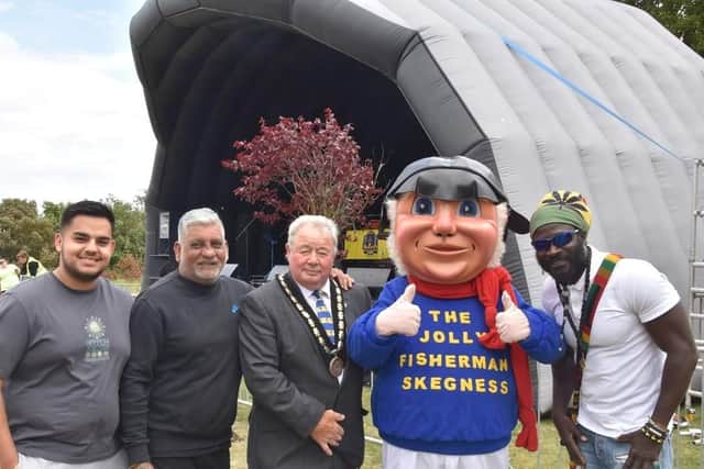 Taj Bola, second left, with his team and the Mayor of Skegness Pete Barry and the Jolly Fisherman. Photo: Barry Robinson.