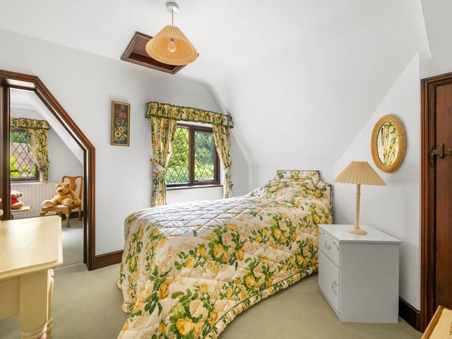 Another one of the bedrooms, with a dressing room off.