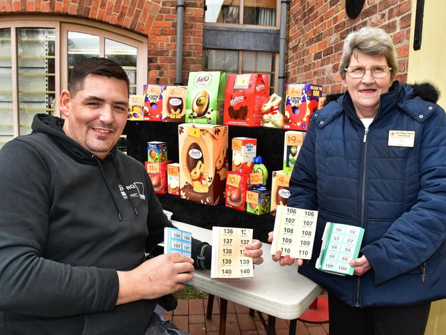 Russ Steadman and Deb Austen selling raffle tickets for eggs.