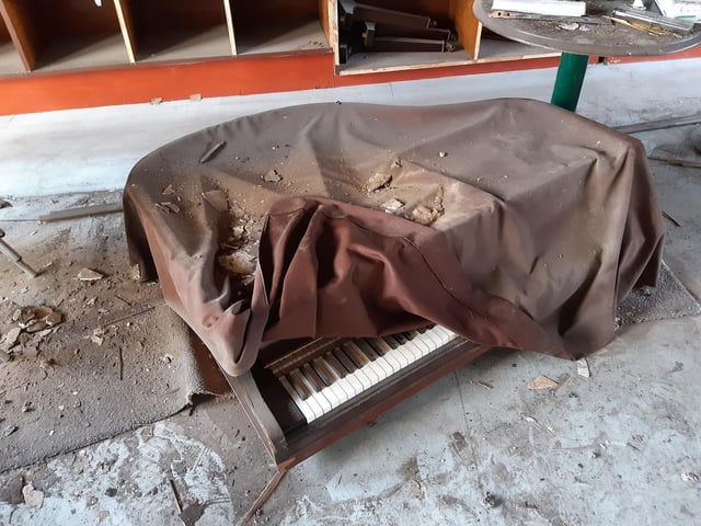 When is a drapers table not a drapers table? When it's a baby grand piano. Among the surprising discoveries made by Shane after he took on the building was finding a baby grand piano on the ground floor, tucked away and out of sight of where customers would have been able to go. "It looked like a drapers table," he said. "I didn't know it was a piano until I started to wheel it around." It was made by Murdoch of London and still works. "It's definitely been well-loved, it's got glass rings on it," said Shane.