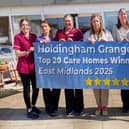 Some of the Holdingham Grange team celebrate, with Registered Home Manager, Rebecca Nisbet (centre). Photo supplied