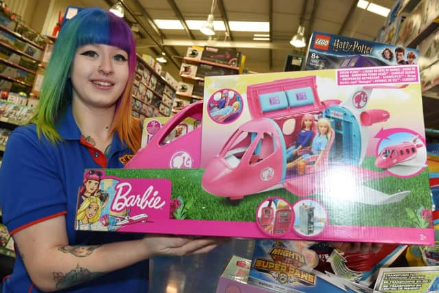 Staff at Smyths Toy store.