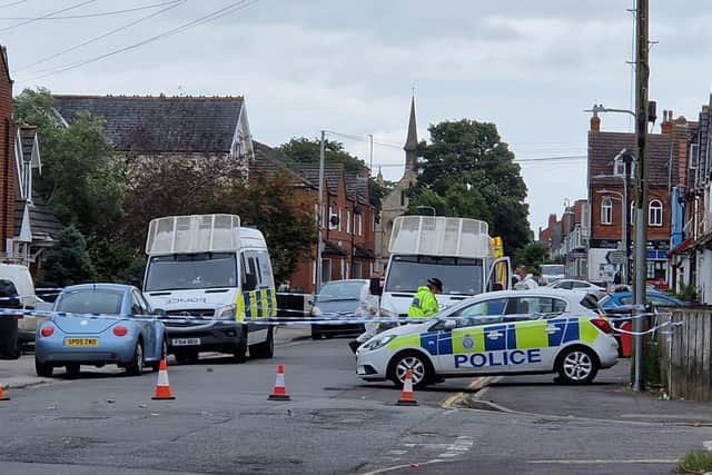 Police remain at the scene of the alleged murder in Grosvenor Road, Skegness.