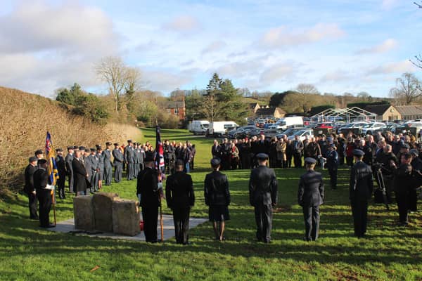 The gathering for the air crash memorial. Photo: SKDC