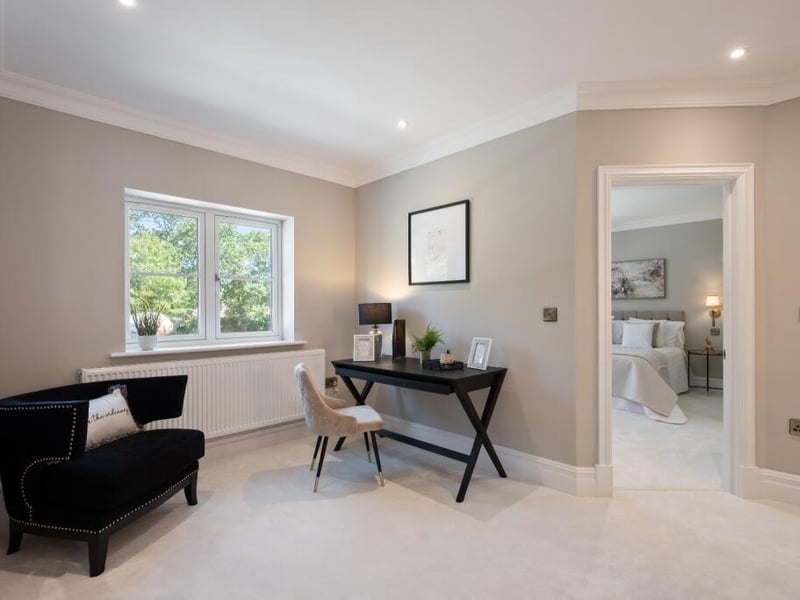 The potential sitting or study area on the landing.