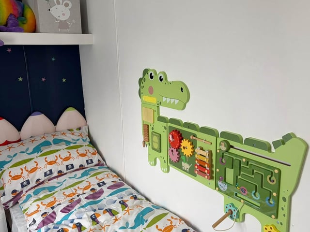 The children's bedroom with bright colours and interactive features.