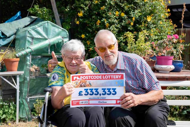 Thumbs up from June and hubby Mike, who also won £333,333.
