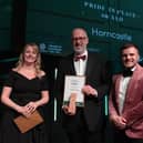 Coun Craig Leyland (centre), leader of East Lindsey District Council, collects the pride in your place award on behalf of the Horncastle Place team. (PHOTO BY: Destination Lincolnshire)