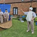 A scene from the modern mystery play, 'Who's My Brother?', as Noah and her family in their ark, discuss their plight with God.