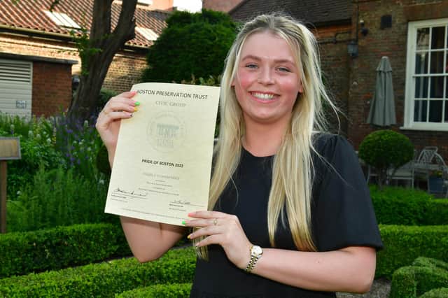 Lauren Taylor, accepts the highly commended award for the new build houses of 1 and 1A in Thorold Street, Boston.