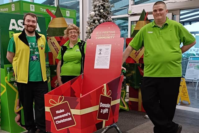 Asda Boston colleagues David Hewitt, Shirley Osborne and Frank Franklin with the collection trolley for Centrepoint Outreach.