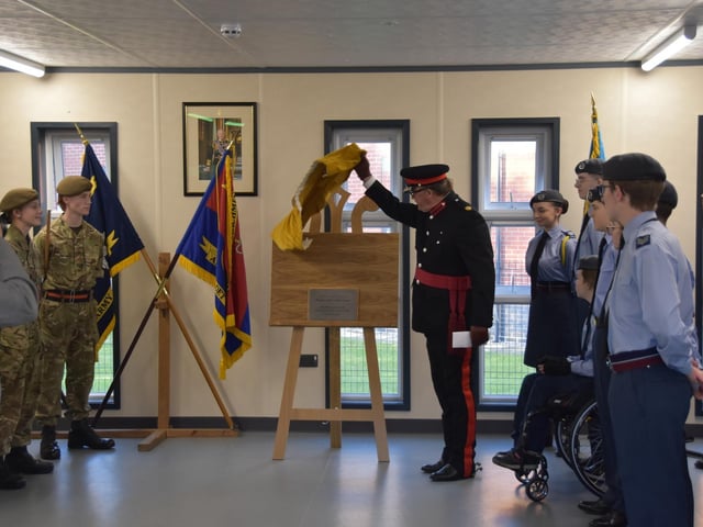 The plaque is unveiled.