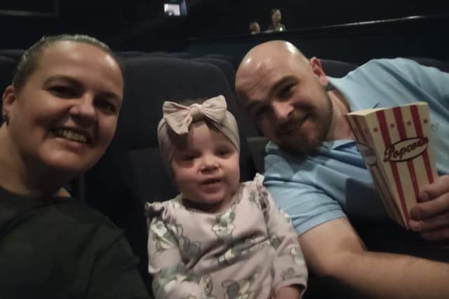 Sally, Olivia, and Jack Volley at Olivia's first trip to the cinema.
