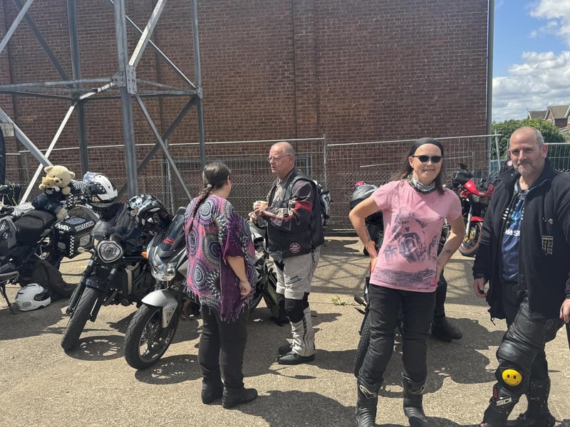 Kibi's stepmum Michelle Gardner at Caistor fire station with Kibi's mum Michelle Barrett (back to camera) thanking fellow bikers.