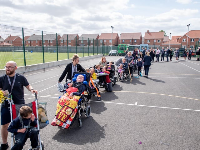 Pupils enjoy a tour around the new outside play areas.