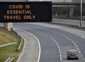A motorway sign on the M8 advising on essential travel only (Photo: Jeff J Mitchell/Getty Images)