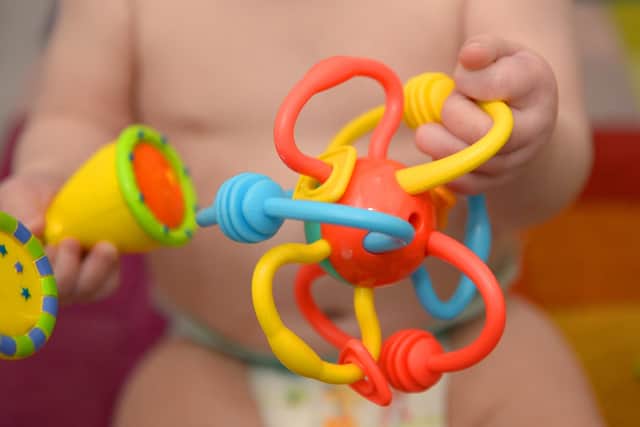 POSED BY A MODEL File photo dated 18/11/2015 of a 9-month-old girl playing with pre-school toys, London. Relatives who step up to look after a child in what is known as kinship care should be given paid leave instead of feeling forced to cut their hours or quit their jobs due to a lack of support, a charity has said. There are more than 162,000 children in England and Wales being raised by either a friend or family member other than their parents, the Kinship organisation said. Issue date: Thursday June 15, 2023.