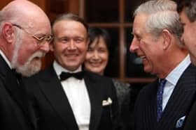 Adrian Benjamin (left) meets the then-Prince Charles in 2010.