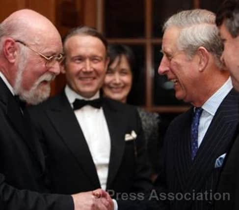 Adrian Benjamin (left) meets the then-Prince Charles in 2010.