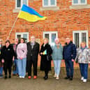 Ukrainian refugees are welcomed by Sleaford Town Council to a flag raising ceremony on Monday showing solidarity and support for their homeland. Photo: Roderick Carlyle