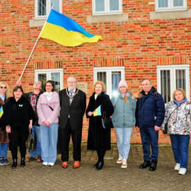 Ukrainian refugees are welcomed by Sleaford Town Council to a flag raising ceremony on Monday showing solidarity and support for their homeland. Photo: Roderick Carlyle