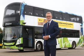 Darren Roe with an electric bus