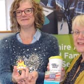 Joanne Hubbert (Left) receives her duck travel challenge prizes from Linda Radford of the 2Aspire Multiply Project.