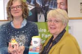 Joanne Hubbert (Left) receives her duck travel challenge prizes from Linda Radford of the 2Aspire Multiply Project.