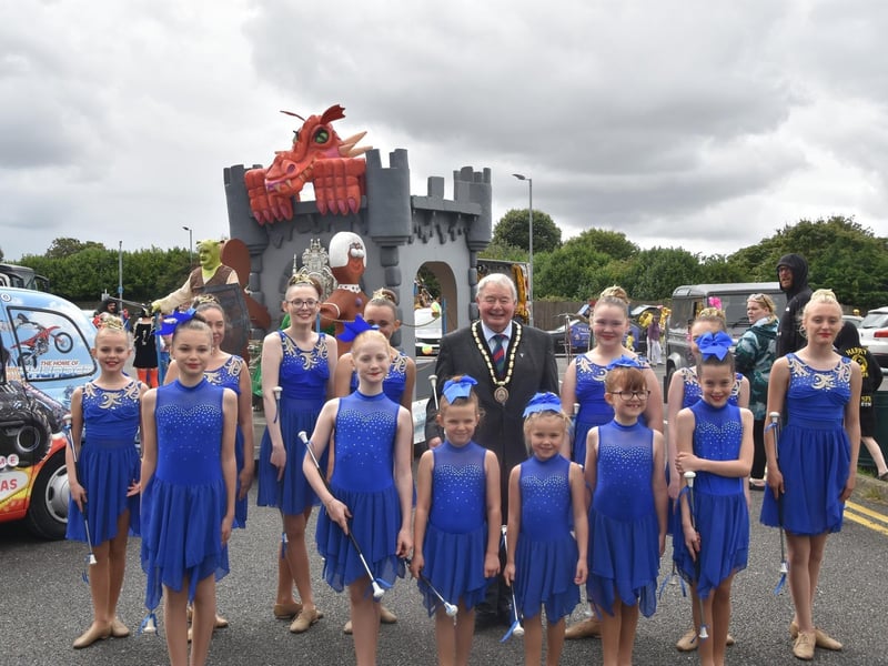 These girls with Mayor Coun Pete Barry danced their way along the parade route and were still smiling at the end.