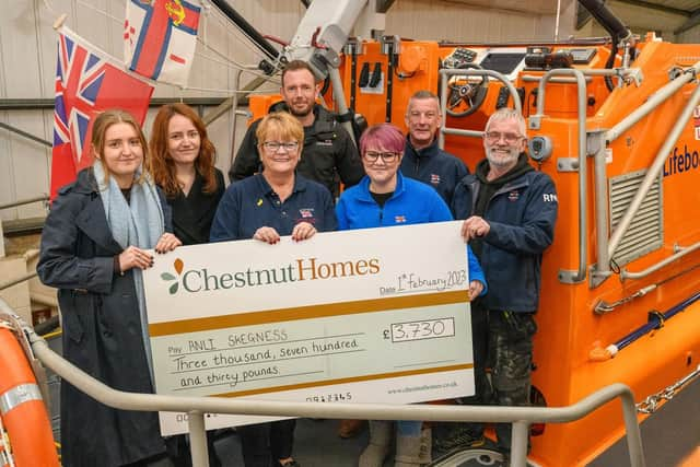 All smiles aboard the Skegness lifeboat as they receive their cheque