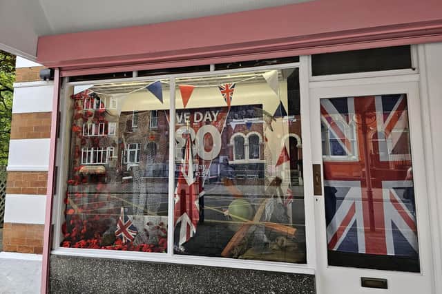 The window of R Lowndes in Skegness where the display featuring a bomb that fell on Skegness will be officially unveiled on Saturday.
