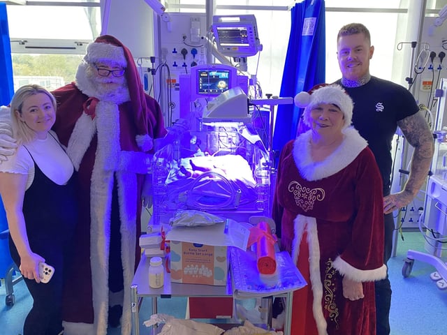 Father and Mrs Christmas pay a visit on Christmas Eve to families at Pilgrim Hospital. Photo: ULHT