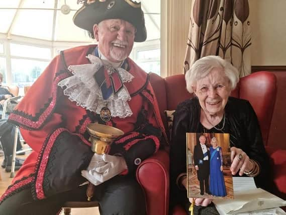 Margaret Myers celebrating her 100th birthday with the Town Crier David Summers.