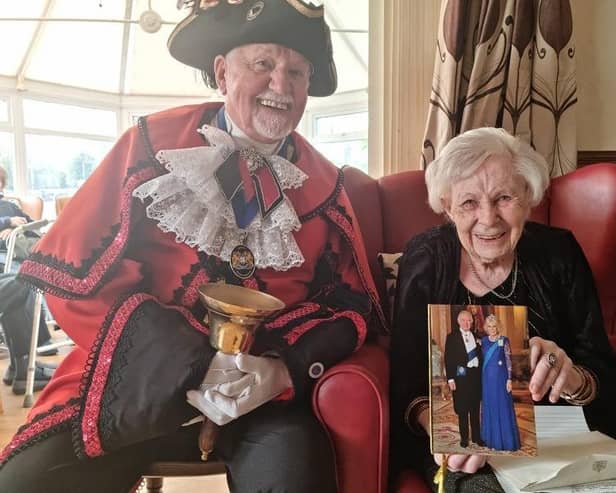 Margaret Myers celebrating her 100th birthday with the Town Crier David Summers.