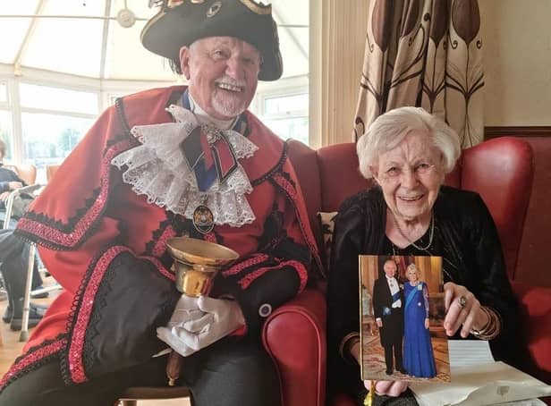 Margaret Myers celebrating her 100th birthday with the Town Crier David Summers.