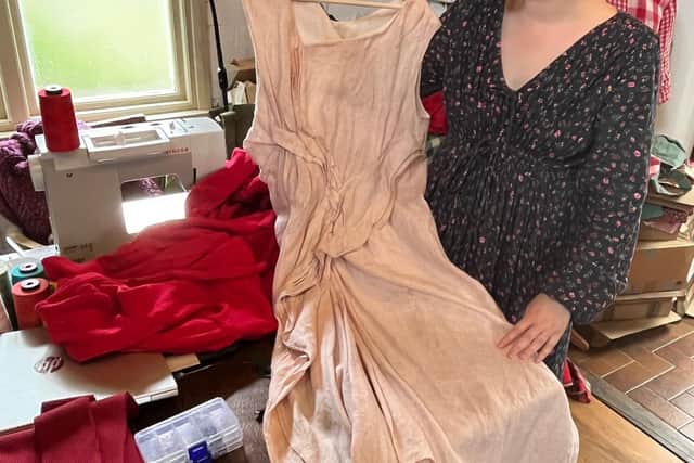Jessica with her new fold dress - her first design.