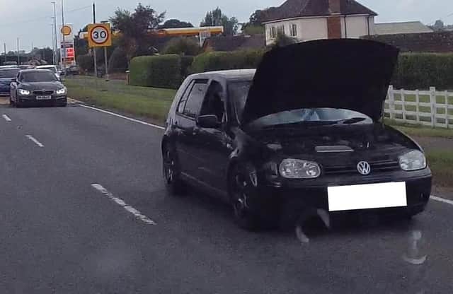 The car spotted driving with the bonnet up. Photo: Lincs Police RPU