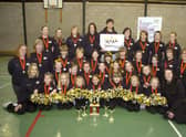 Boston's United Cheer Team squad with medals and trophies in 2012.