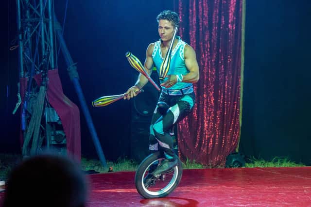 Unicyclists at the circus show.