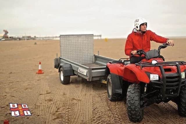 A lifeguard on a quad bike like one stolen.