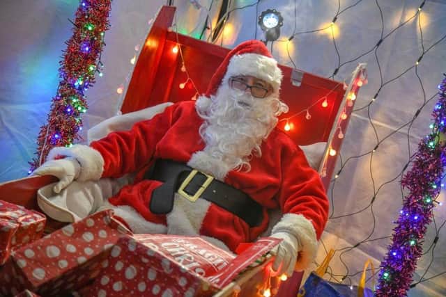 Santa arrives at last year's Christmas fair in Woodhall Spa. But his red suit has been spoiled by Scrooge's red tape this year. (PHOTO BY: Eclipse Photographic)