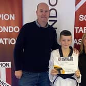 Cody Glen with coach Tony Morgan and assistant instructor Gillian Fairbrother