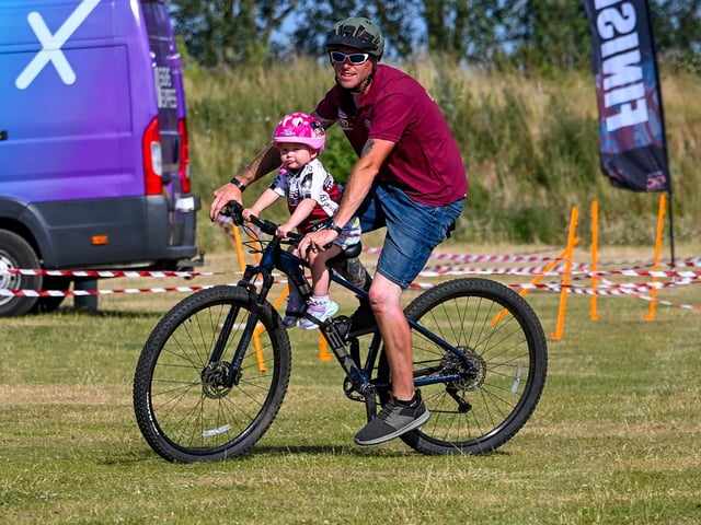 Chris Turner with a new recruit to the cycling club. Photo: Richard Howes Photography