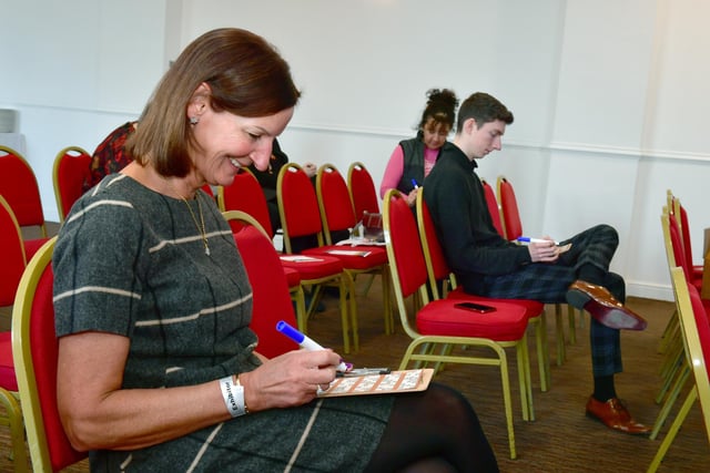 Wendy Froggatt of Windale Furnishings, Skegness, enjoying a break from her stand for a game of bingo.