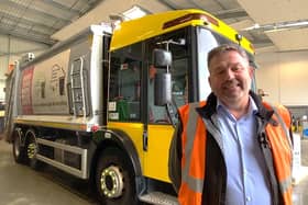 Leader of NKDC Coun Richard Wright with one of the converted bin lorries. Photo: NKDC
