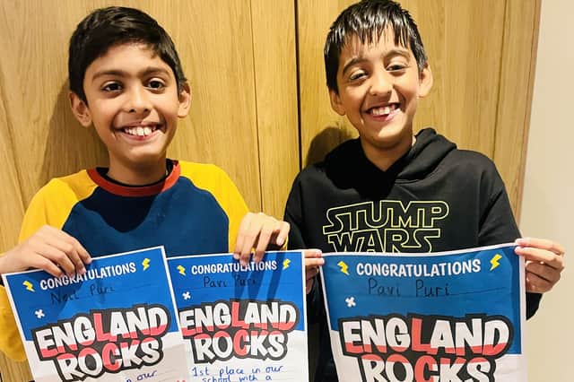 Pavi Puri (right) and his brother Neil, with their TimesTable Rockstar maths certificates.