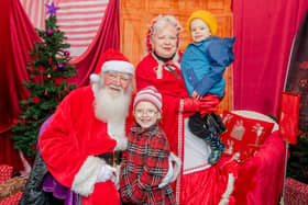 Mr and Mrs Claus with Noah Ismay, 4, and Lydia Ismay, 6. Photos: John Aron Photography